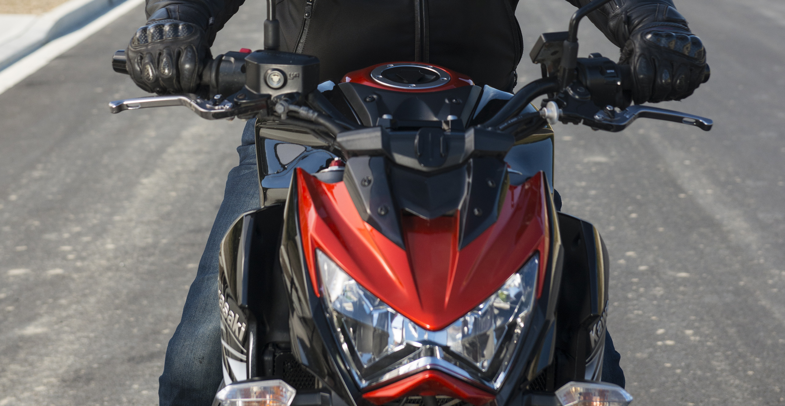 Close up of the front of a street bike with rider